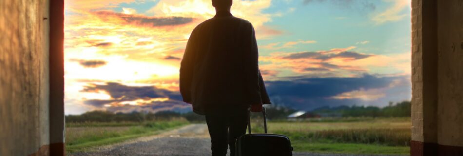 man holding luggage photo