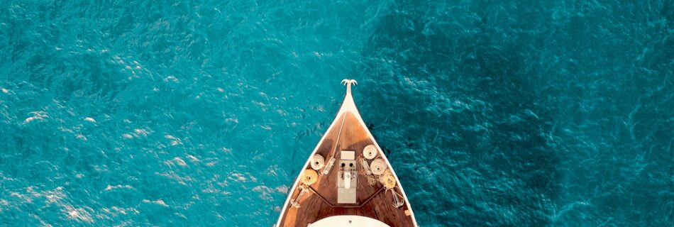 birds eye photography of boat on body of water